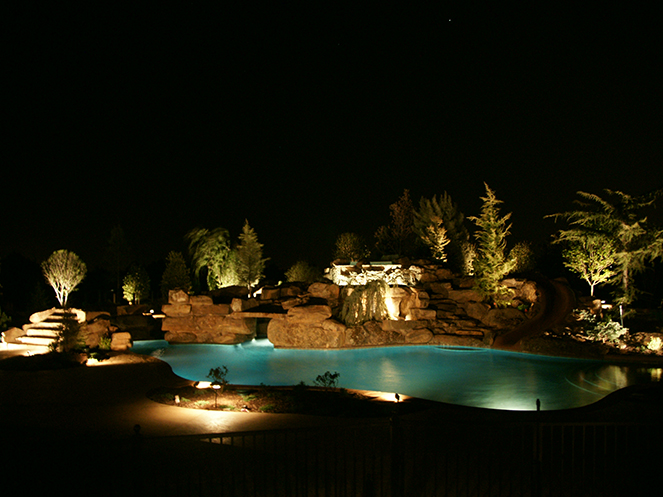 Scapes Inc Landscaping OKC provided this photo for a custom backyard pool landscape lighting design near Oklahoma City, OK. Scapes Inc Landscaping OKC provided this photo for a custom backyard pool landscape lighting design near Oklahoma City, OK.