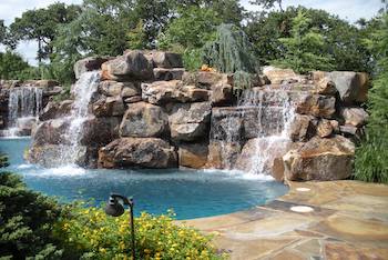 Photo of a water fall from scapes inc landscaping yukon ok.